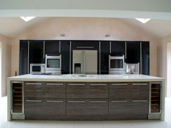A high gloss mix kitchen with central island and corian wrap around